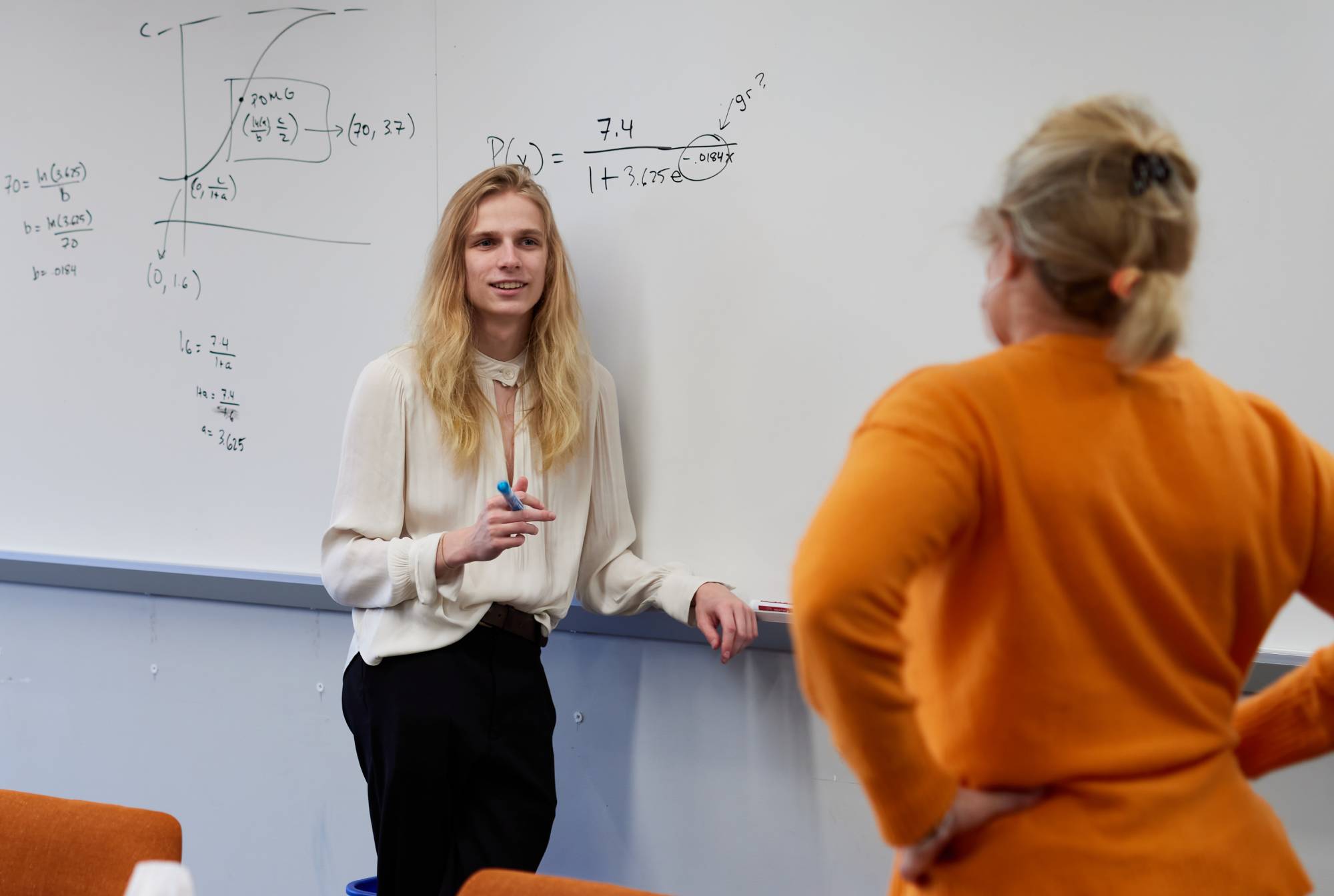 Photo of teacher talking to a student