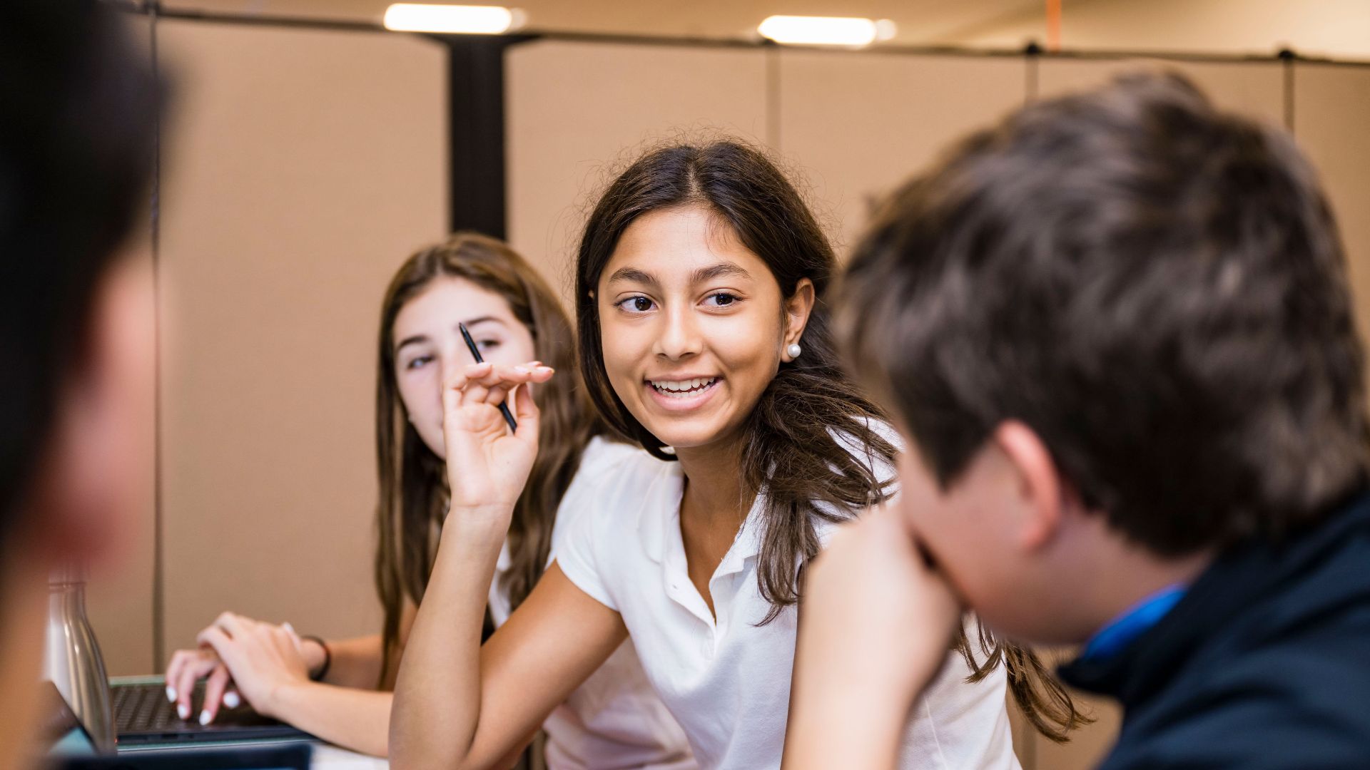 Photo of middle school students talking amongst themselves